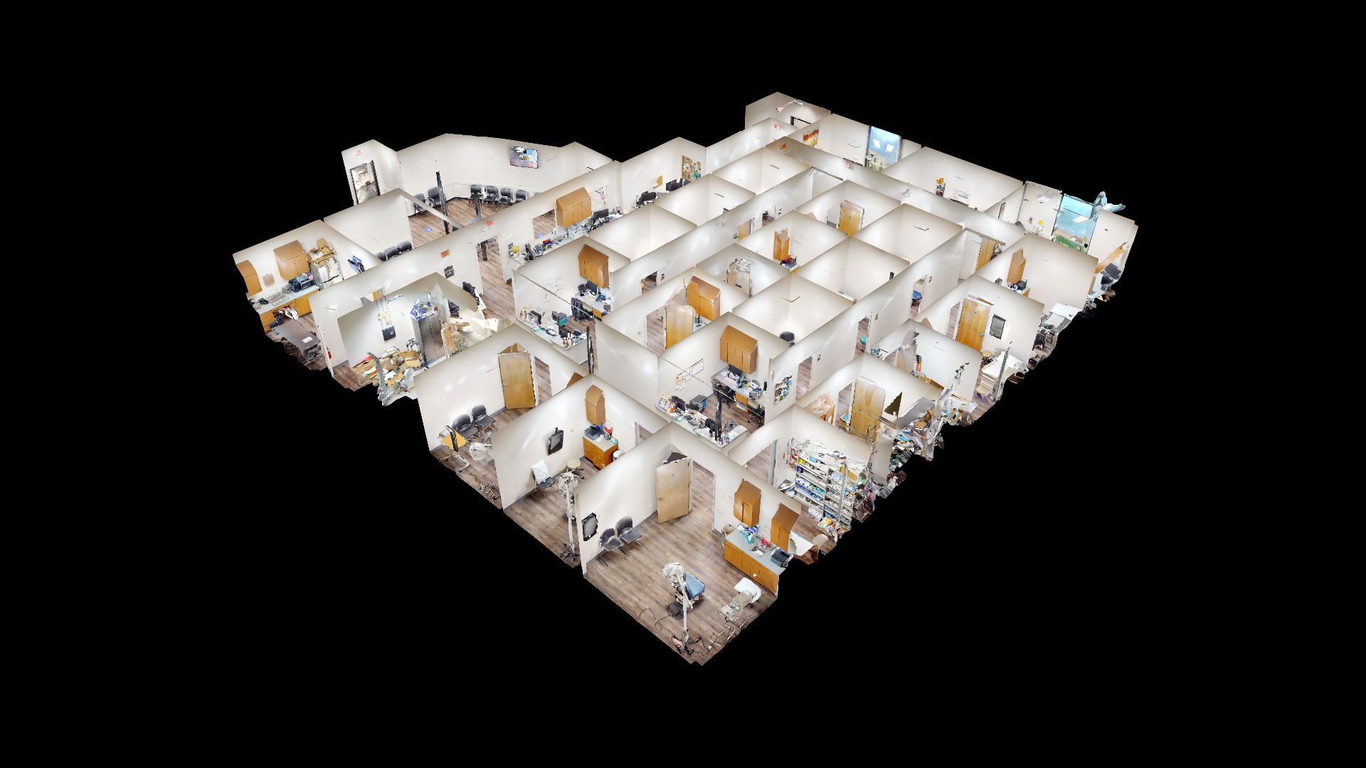 Wide-angle commercial interior with staircase, lobby, corridors, doors, and windows.